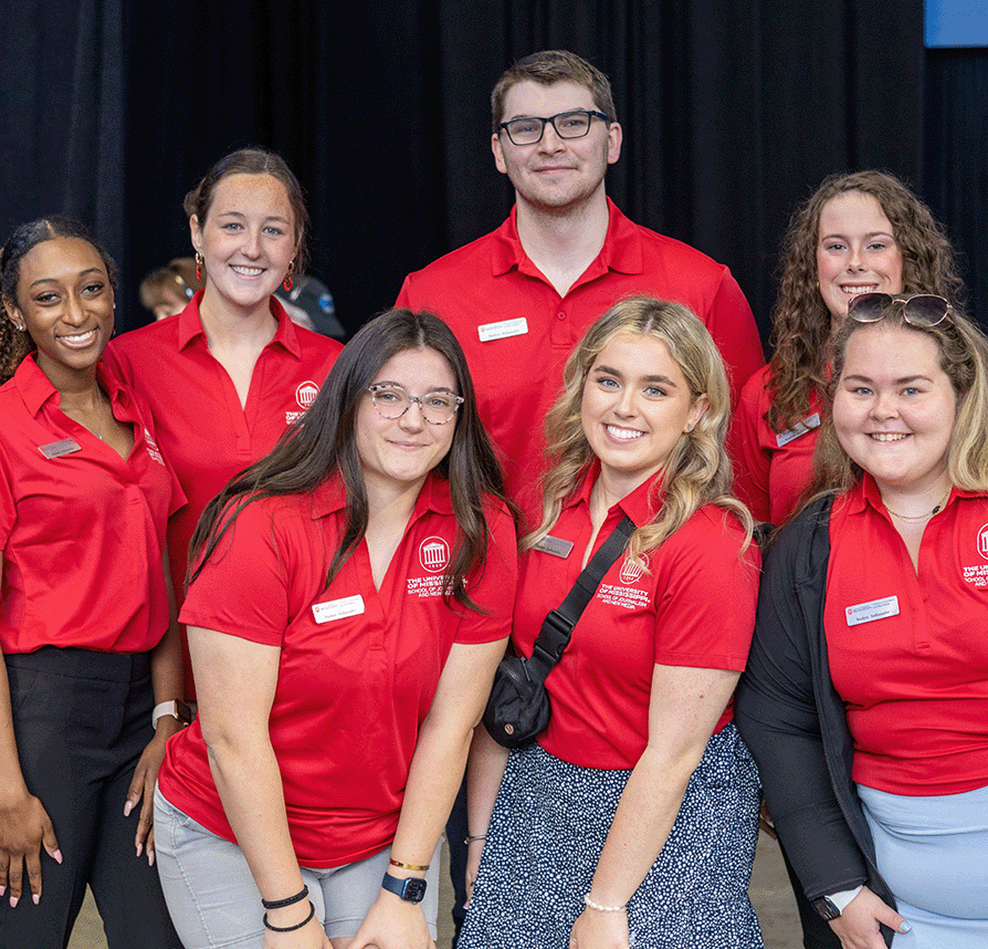 Group of student ambassadors pose for a photo.