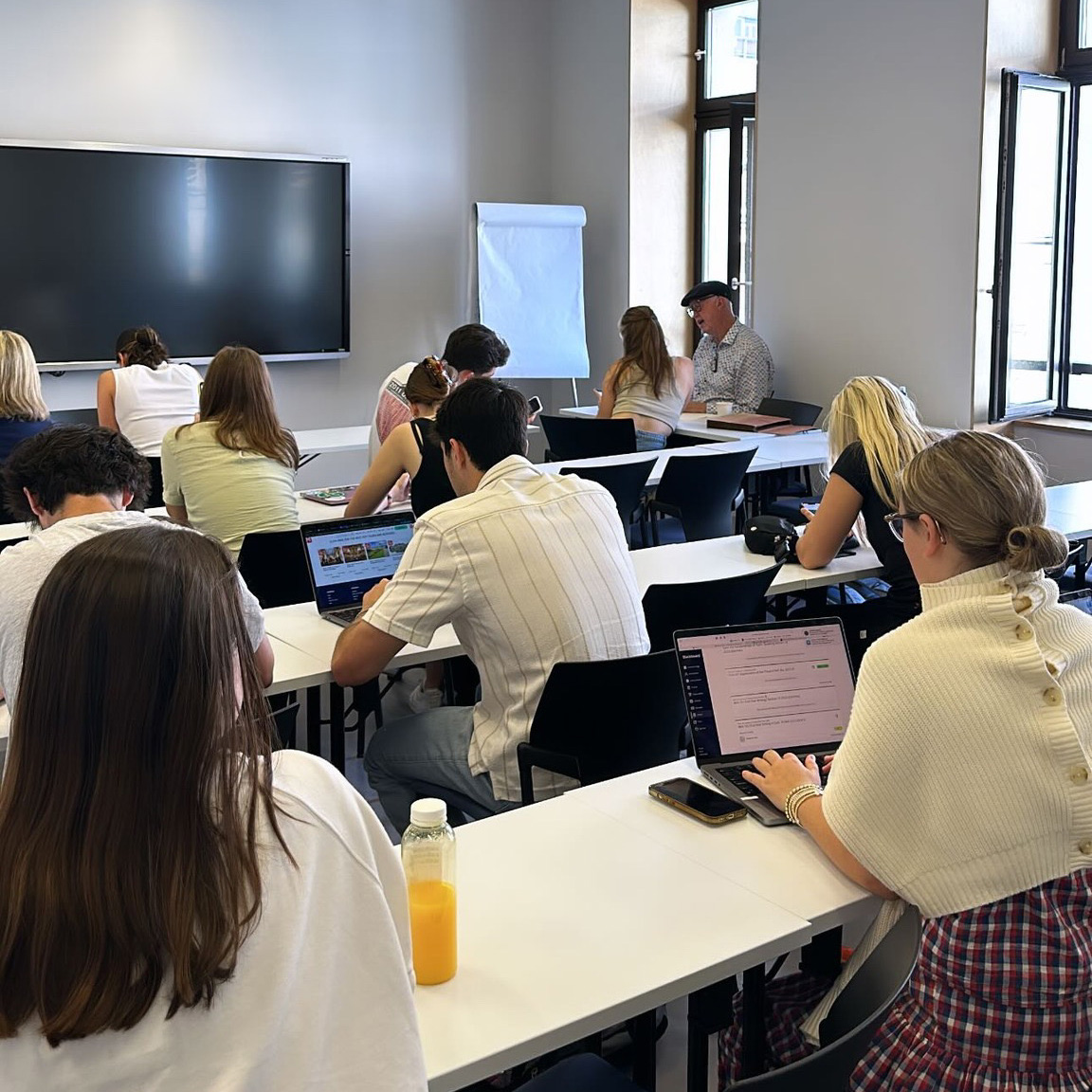 Professor talks to a classroom of students.