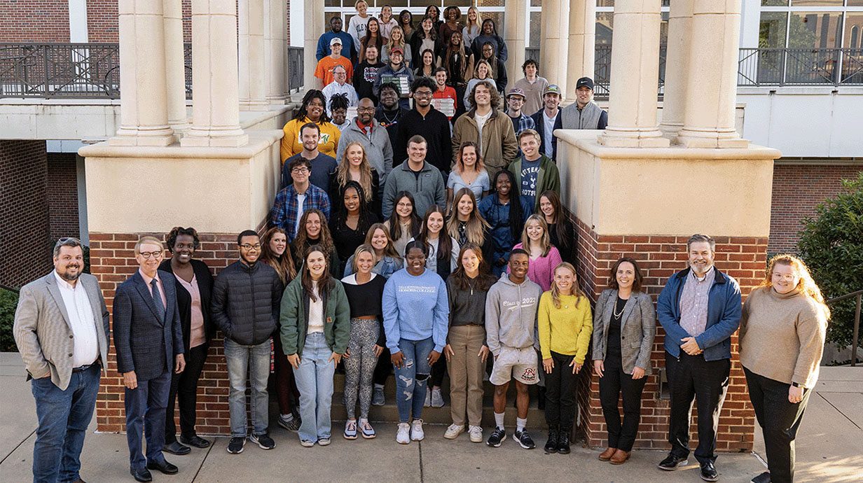 Group photo of students on stairs.