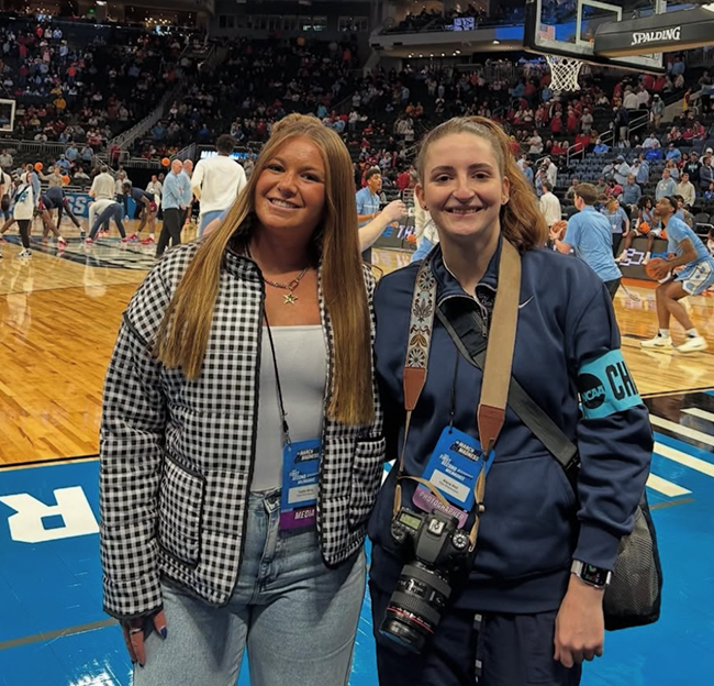 Two students on a basketball court.