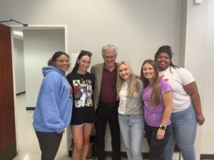Journalism professor Joe Atkins (second from left) spends time with students in his last classes before retiring. They are (from left) Delila Nakaidinae, Hayden Wiggs, Eva-Marie Luter, Allie Watson and Jaylin R. Smith. Submitted photo